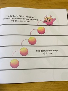 A single page spread with just the musical staff this time. Another character from the book, Skip, who is a round red, orange and yellow shape, with 3 round eyes, horns and a curl sticking up from their head, is moving along the staff. Skip bounces from one note to the next, skipping out some of the lines or spaces.