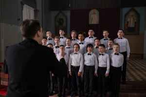 A boys' choir sings in church.