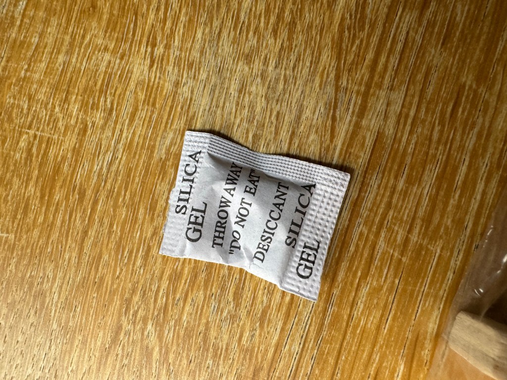 There is a small pack of silica gel inside the packaging of the Decorate Your Own wooden xylophones kit. You should take particular care to make sure your child doesn't get hold of it.